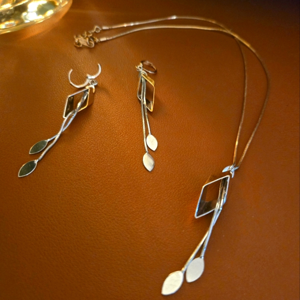17" goldtone and silver necklace and earring set